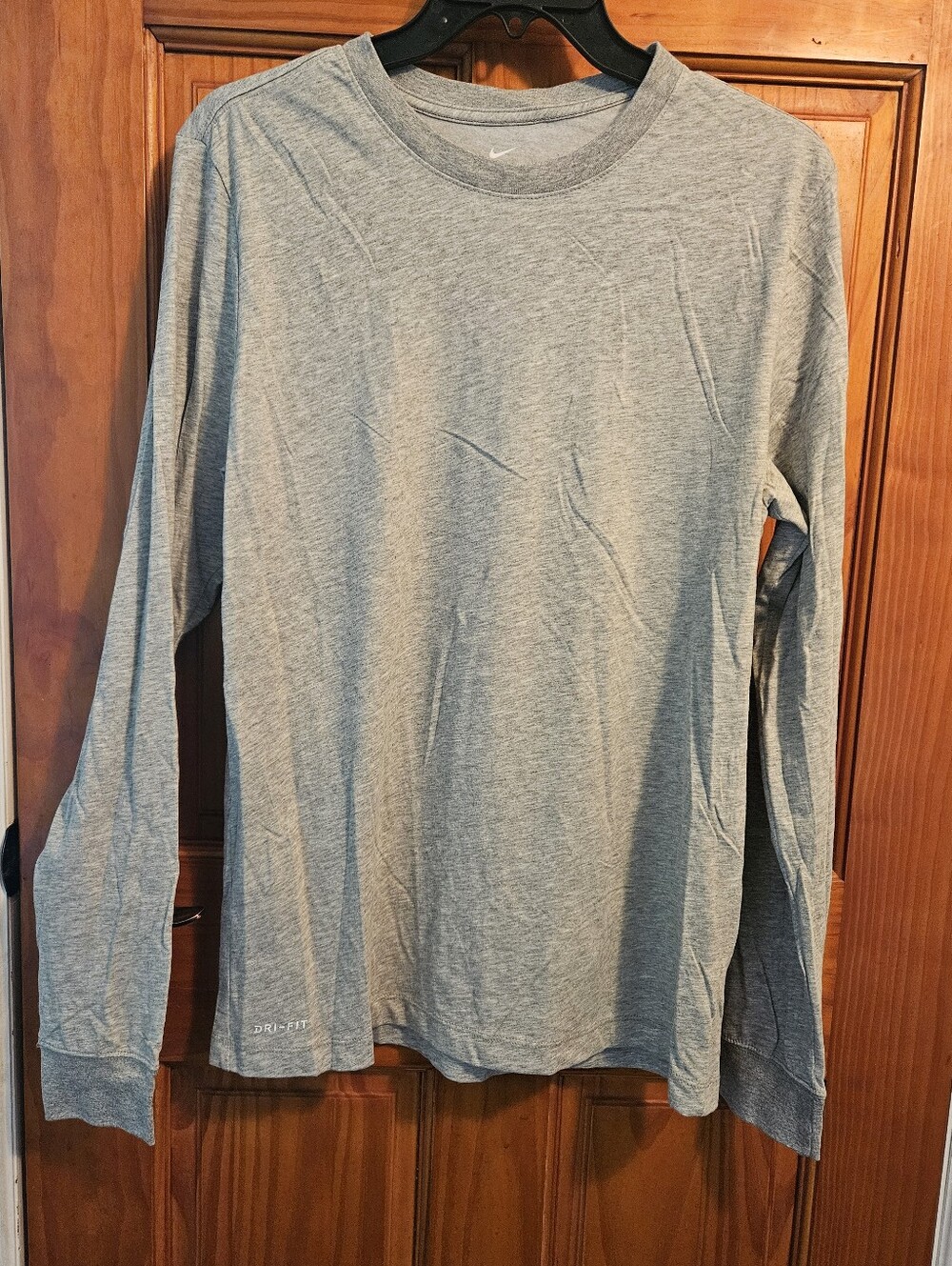 The Nike Tee dri-fit long sleeve light gray Never worn
